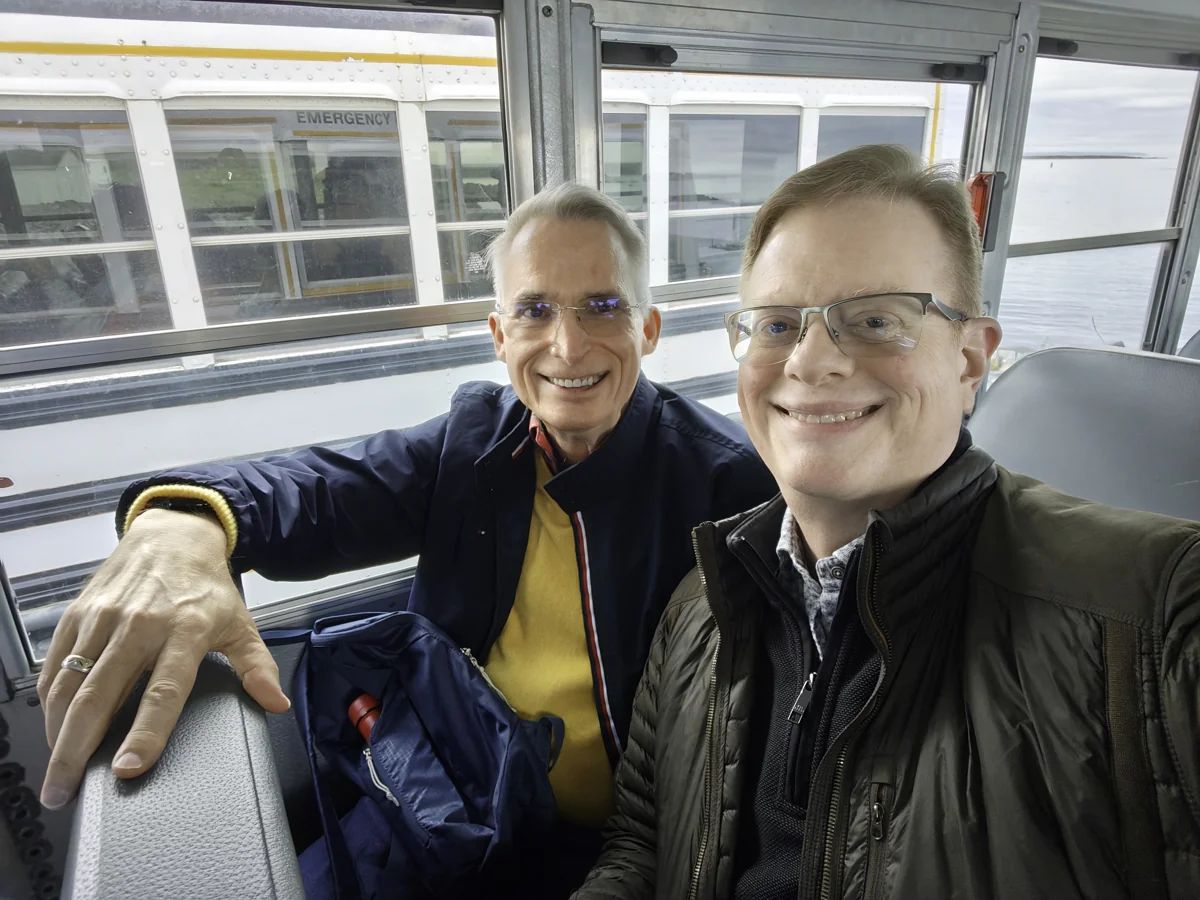 Mark and Clyde smiling on a ferry